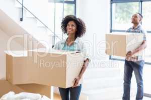 Young couple moving together in a new house