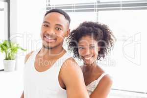 Young couple embracing each other in bathroom