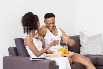 Man gifting a rose to woman