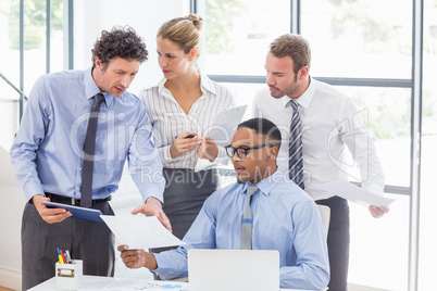 Business colleagues discussing a report