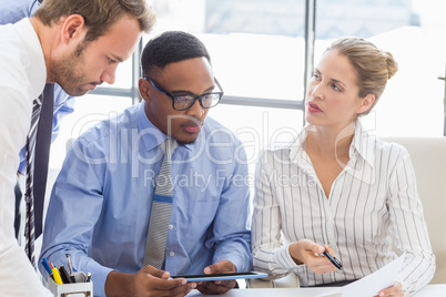 Business colleagues discussing a report