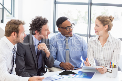 Business colleagues discussing a report
