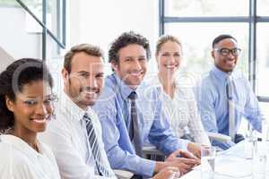 Businesspeople sitting together in meeting