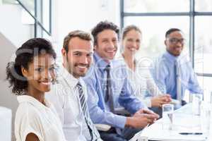 Businesspeople sitting together in meeting