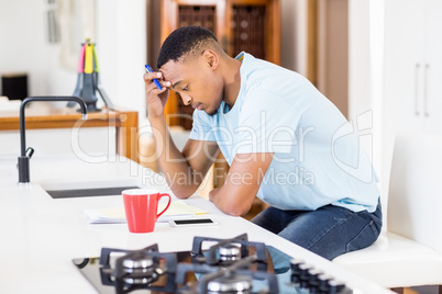 Worried man looking at bills