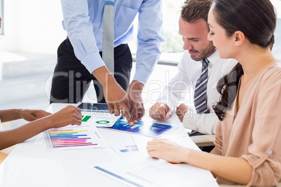 Businesspeople discussing a report