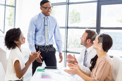 Businesspeople discussing a report