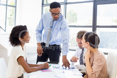 Businesspeople discussing a report