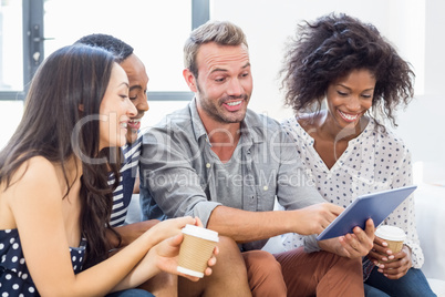 Friends looking at digital tablet