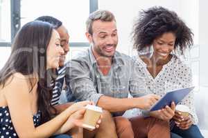 Friends looking at digital tablet