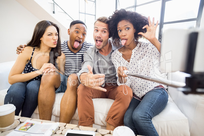 Friends making funny faces while taking a selfie