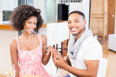 Happy couple showing ring