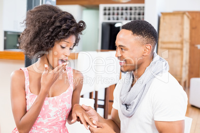Man gifting finger ring to her woman