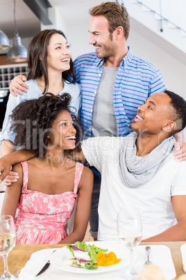 Friends looking at each other and smiling