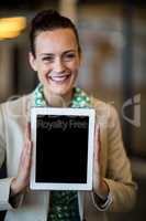 Businesswoman holding digital tablet