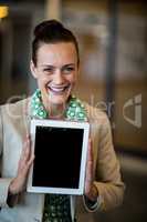 Businesswoman holding digital tablet