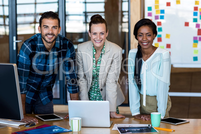 Young man and women leaning on the desk