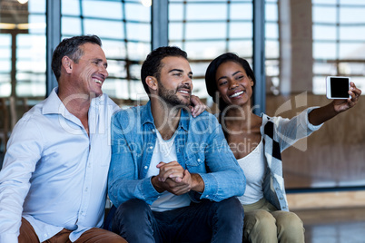 Happy Colleagues taking selfie