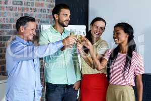 Colleagues toasting champagne flutes