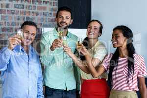 Colleagues toasting champagne flutes