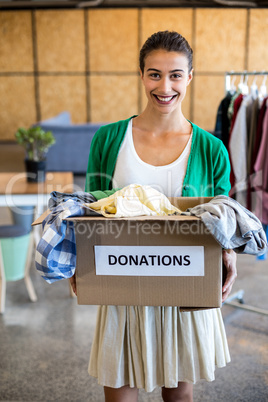 Young woman with donation box