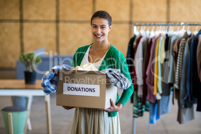 Young woman with donation box
