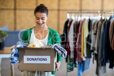 Young woman with donation box