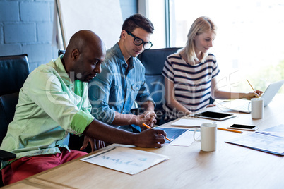 Colleagues working at their desk