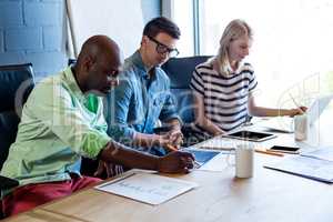 Colleagues working at their desk