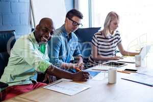 Colleagues working at their desk