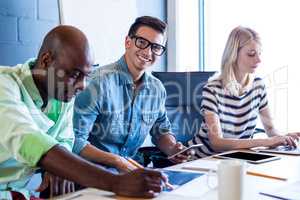 Colleagues working at their desk