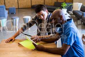 Colleagues interact using digital tablet