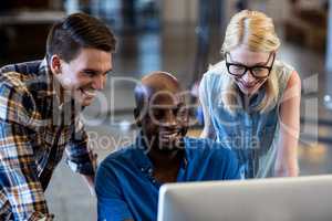 Colleagues working on computer together