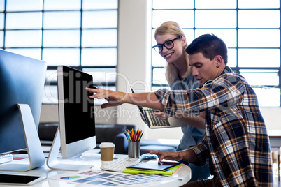 Graphic designer interacting at their desk