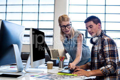 Graphic designer interacting at their desk