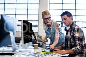 Graphic designer interacting at their desk