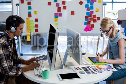 Graphic designers working at their desk