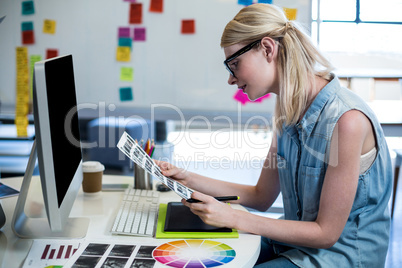 Graphic designer working at her desk