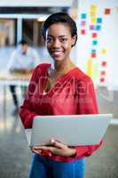 Young woman holding laptop