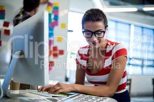 Graphic designer working at her desk