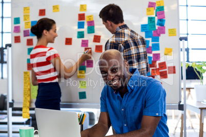 Graphic designer smiling at camera