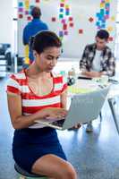 Young woman using laptop