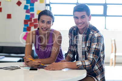 Colleagues sitting at their desk Colleagues sitting at their desk
