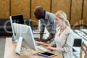 Colleagues working on computer together