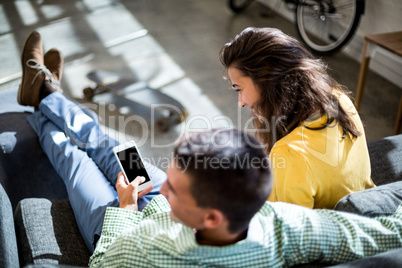 Colleagues using mobile phone