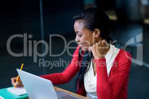 Young woman sitting at her desk