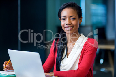 Young woman sitting at her desk