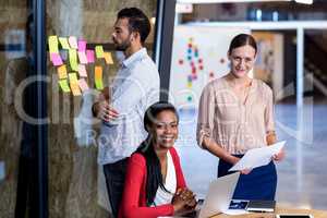 Team of colleagues at their desk