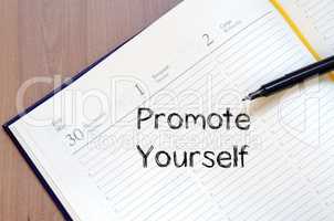 Promote yourself write on notebook