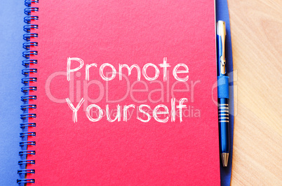 Promote yourself write on notebook